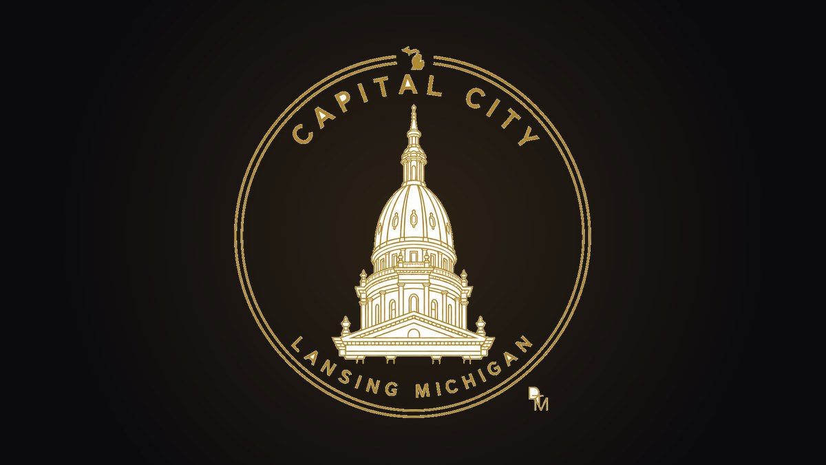Capital City monoline capitol dome ring design in gold on a black crewneck