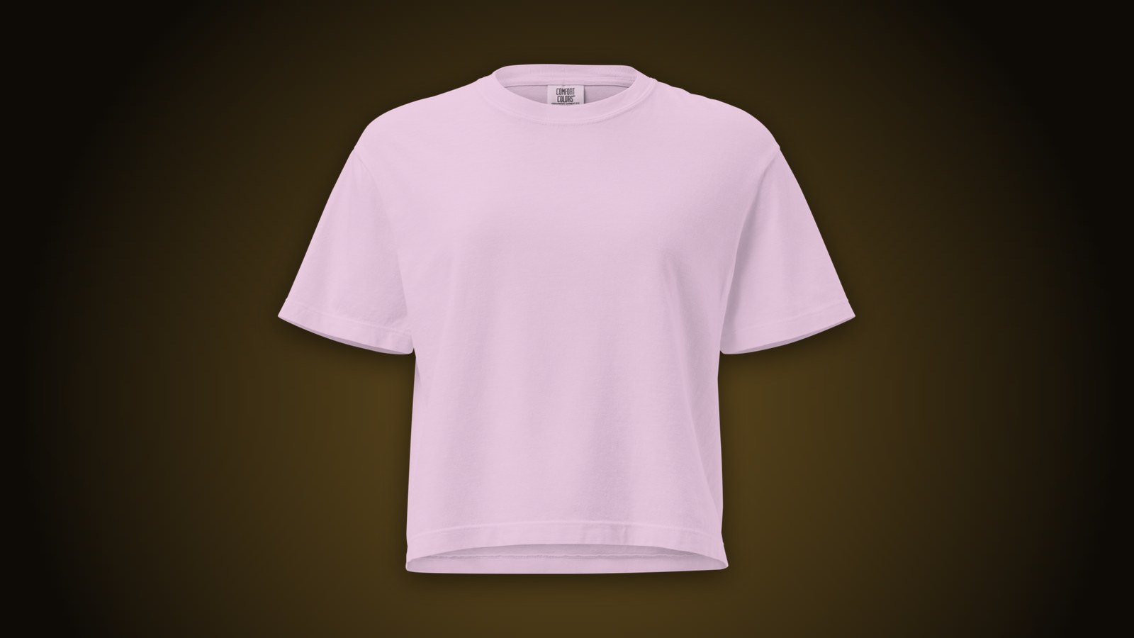 Orchid Comfort Colors boxy tee blank on a dark gold-lit background